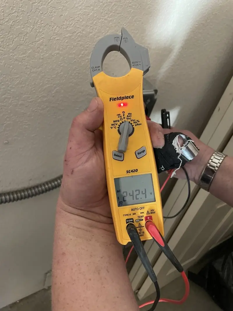 Voltage testing with clamp meter during Electrical Installation Services in Bosque Farms